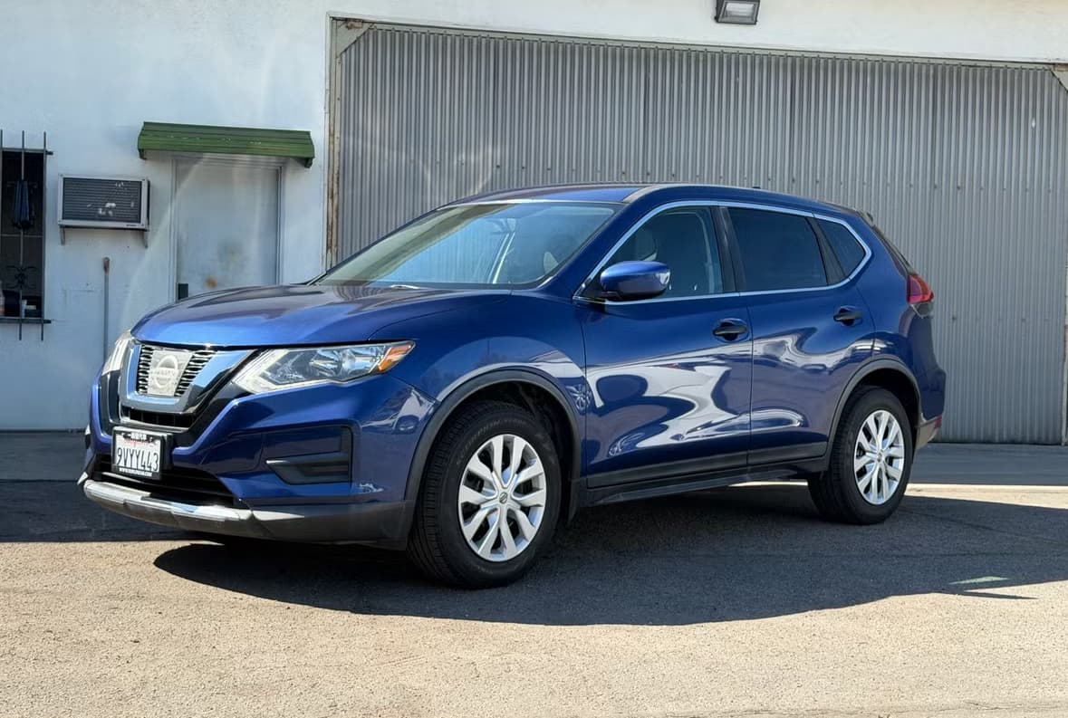 Blue Nissan Rogue rental car