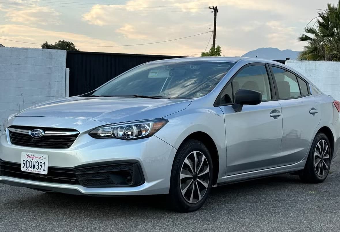 Silver Subaru Impreza rental car