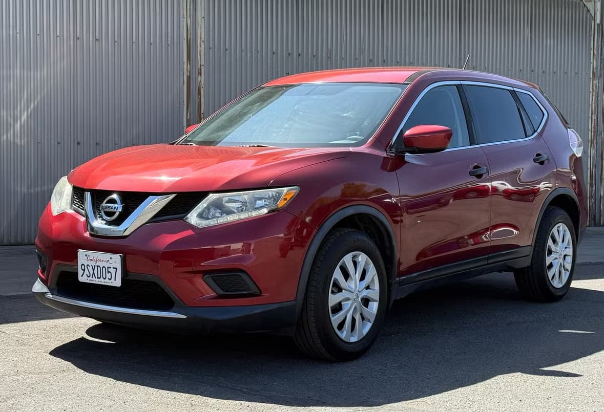 Red Nissan Rogue rental car