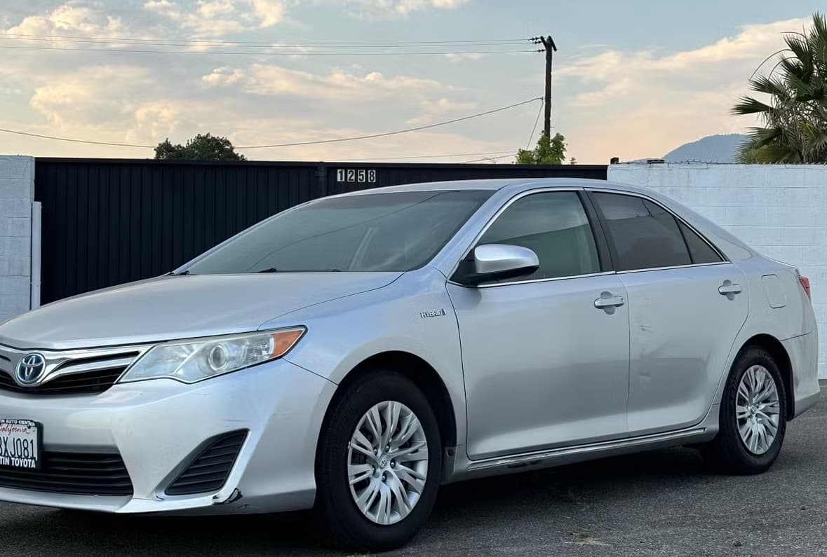 Silver Toyota Camry Hybrid rental car